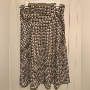 Zac & Rachel midi flare skirt. Tan, white and black geometric pattern. Size M.